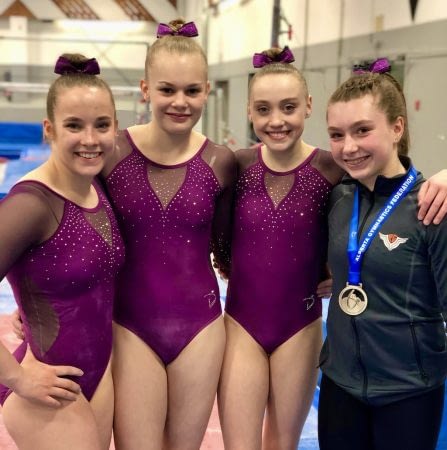 womens athletes 1024 four female gymnastics in club leotards and team jacket